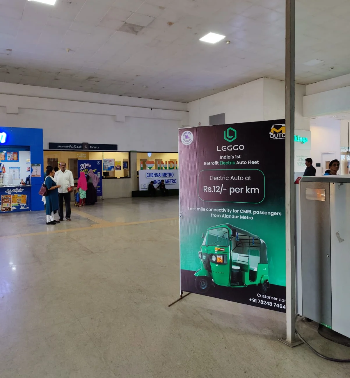 A Leggo standee inside a metro station: electric auto at ₹12 per km